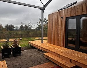 Veranda with wooden terrace at Huisje in Rijssen, vacation home in Twente, Overijssel.
