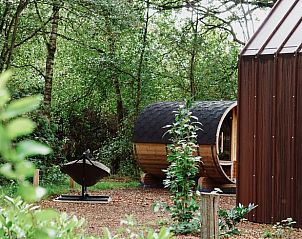 Buitensauna en tuin bij Huisje in Enschede, vakantiehuis in Overijssel.