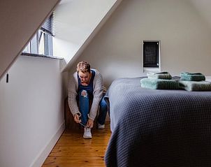 Gezellige zolderkamer in Huisje in Enschede, vakantiehuis in Twente, met rustieke charme in Overijssel.