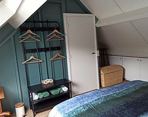 Slaapkamer in Huisje in Oldenzaal, vakantiehuis in Twente, met comfortabele voorzieningen.