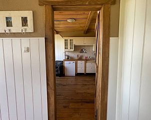 Cozy interior of Holiday home in Markelo, Twente, with wooden details and country kitchen in Overijssel.