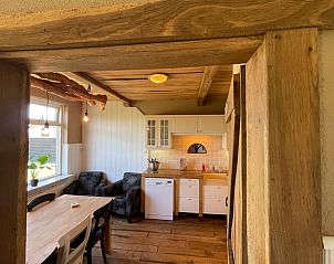 Cozy indoor area of Holiday home in Markelo, Twente with wooden interior and country kitchen in Overijssel.