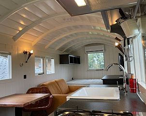 Stylish interior of Holiday Home in Markelo, Twente, Overijssel with modern kitchen and cozy sitting area.