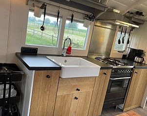 Fully equipped kitchen in Holiday cottage in Markelo, Twente, Overijssel overlooking the green surroundings.