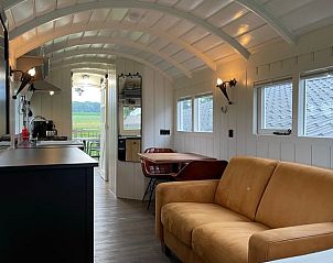 Cozy living room in Holiday Home in Markelo, Twente, Overijssel with comfortable sofa and dining area.