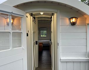 Entrance to Holiday Home in Markelo, Twente, Overijssel with inviting open door to the interior.