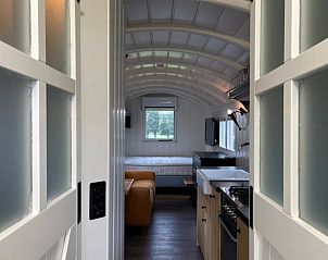 Entrance of Holiday cottage in Markelo, Twente, Overijssel overlooking the stylish kitchen and living room.