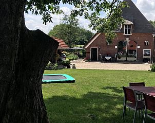Geniet van de rust bij Vakantiehuisje in Markelo, Twente. Ontspan in de groene tuin van deze charmante vakantiewoning in Overijssel.