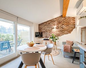 Modern open kitchen and sitting area in Holiday home in Usselo, Twente, ideal for a relaxing stay.