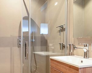 Cozy sitting area with TV in Holiday home in Usselo, Twente, ideal for relaxing after a day of exploring.