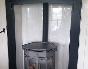 Gezellige haard in Vakantiehuisje in Daarle voor knusse avonden in Twente, Overijssel.