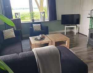 Moderne woonkamer in Vakantiehuisje in Daarle met gezellige inrichting in Twente, Overijssel.