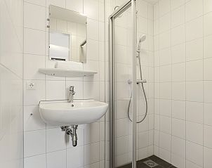 Auenansicht des Ferienhauses Sallandse Heuvelrug 8C, Twente, mit moderner Architektur und grner Umgebung.