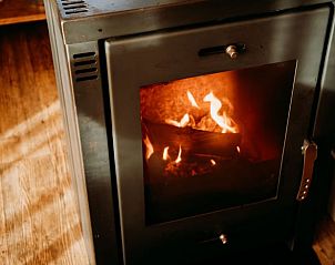 Cozy wood stove in the Holiday Home in Buurse, Twente, Overijssel for a warm atmosphere in the vacation home.