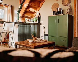 Cozy interior of Holiday cottage in Buurse, Twente with wooden interior and modern kitchen in Overijssel.