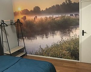 Sfeervolle slaapkamer met natuurdecor in Vakantiehuisje in Lattrop, Twente, Overijssel.