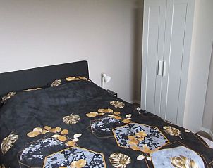 Slaapkamer met tweepersoonsbed in Vakantiehuis in Olst, knus verblijf in Salland, Overijssel.