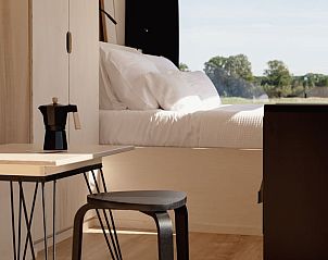 Gezellige zithoek in Vakantiehuis in Wesepe met uitzicht op de natuur van Salland, Overijssel