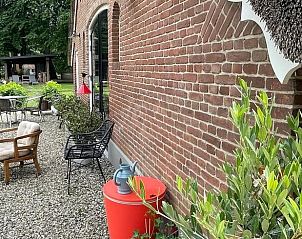 Cozy sitting area outside at Cottage in Dalfsen, vacation accommodation in Overijssel.