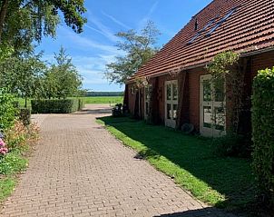 Charmante buitenkant van Huisje in Balkbrug, vakantieaccommodatie in Vechtstreek, Overijssel met uitzicht op de natuur.