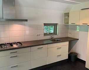 Modern kitchen in Holiday home in Lemele, Vecht region Overijssel, with stylish decor and views of green nature.