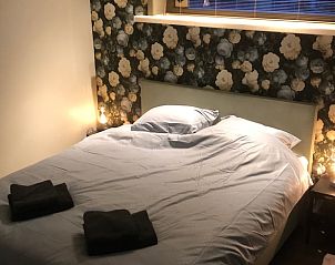 Sfeervolle slaapkamer in Vakantiehuisje in Vinkenbuurt, Vechtstreek, Overijssel.