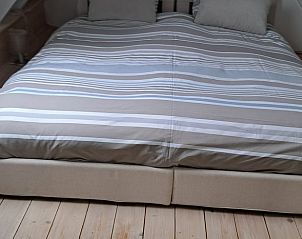 Comfortabel tweepersoonsbed in de zolderkamer van Vakantiehuisje in Tuk, Noordwest Overijssel.