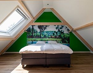 Lichte slaapkamer in Huisje in Abcoude, vakantiehuis in Utrecht noord, met prachtig uitzicht.