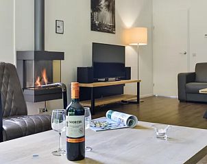 Amerongse Berg vakantiehuis in Overberg met sfeervolle open haard en gezellige zithoek op de Utrechtse Heuvelrug.