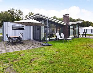 Amerongse Berg vakantiehuis in Overberg met terras en groene tuin, ideaal voor ontspanning op de Utrechtse Heuvelrug.