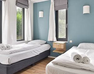 Slaapkamer met twee eenpersoonsbedden in Amerongse Berg vakantiehuis, Overberg.