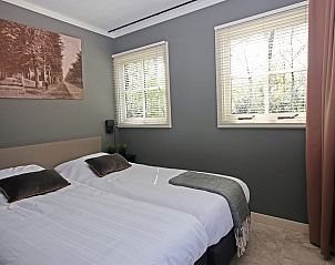 Sfeervolle slaapkamer in Vakantiewoning Molenbosch, Doorn, Utrechtse Heuvelrug. Comfortabel vakantiehuis met serene natuuruitstraling.
