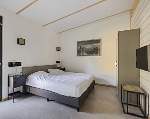 Schlafzimmer im angepassten Bungalow Sandenburg, Doorn, Utrechtse Heuvelrug, mit bequemem Doppelbett.