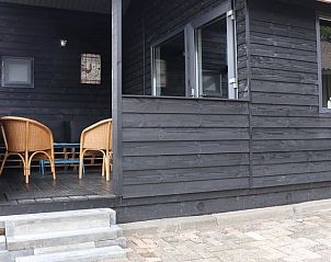 Gezellige veranda van Vakantiehuis in Achterveld op de Utrechtse Heuvelrug, Utrecht, perfect voor ontspanning in een landelijke omgeving.