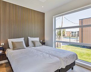 Slaapkamer met tweepersoonsbed in Tiny house 3 persoons, Lexmond, Utrecht.