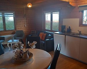 Open kitchen and dining area in Holiday home in Wissenkerke, ideal for family dinners in Zeeland.