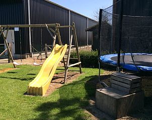 Playground equipment for children at Holiday home in Wissenkerke, North Beveland, for fun and adventure.