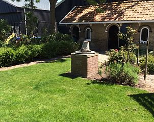Charming outdoor space with greenery at Holiday home in Wissenkerke, North Beveland, ideal for relaxation.