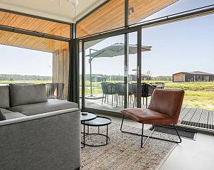 Comfortable sitting area in Cottage in Wissenkerke with terrace view in Zeeland.