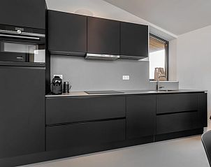 Stylish kitchen in Cottage in Wissenkerke, North Beveland with modern appliances.