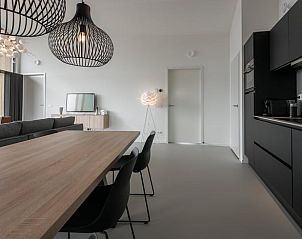 Modern kitchen and dining area in cottage in Wissenkerke, North Beveland.