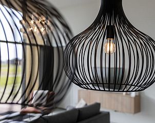 Design lighting in the living room of Huisje in Wissenkerke, Zeeland.