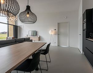 Dining room overlooking nature in Cottage in Wissenkerke, North Beveland.