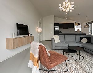 Cozy sitting area in cottage in Wissenkerke with modern decor in Zeeland.