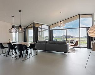 Cozy living room with dining area in Cottage in Wissenkerke, North Beveland.