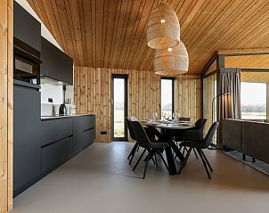 Modern kitchen and dining area at Huisje in Wissenkerke, a vacation home in Wissenkerke, North Beveland, Zeeland.