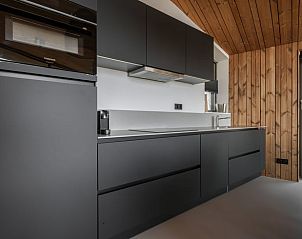 Open living room and dining area in Cottage in Wissenkerke, located in Wissenkerke, North Beveland, Zeeland.