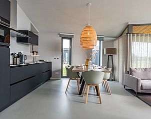 Open kitchen and dining area in Holiday home in Wissenkerke, Noord-Beveland, Zeeland.
