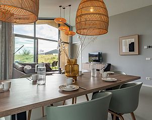 Bright dining room in Holiday home in Wissenkerke, Noord-Beveland, Zeeland with view.