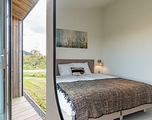 Bedroom with view in Holiday home in Wissenkerke, Noord-Beveland, Zeeland.